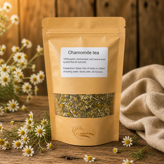 Chamomile tea package on a wooden surface with chamomile flowers and a cloth.
