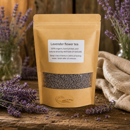 Brown package of lavender flower tea with lavender flowers around on a wooden surface