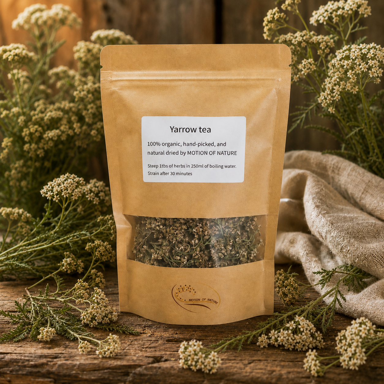 Yarrow tea package on a wooden surface with yarrow plants